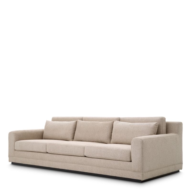 A sumptuous sofa with a luxury beige upholstery