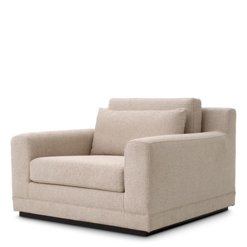 A sophisticated armchair with a luxury beige upholstery
