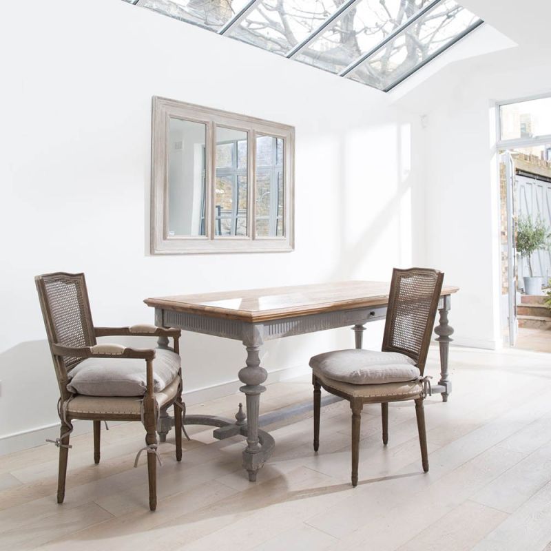 Rustic grey wash dining table with a small drawer and gorgeous silhouette