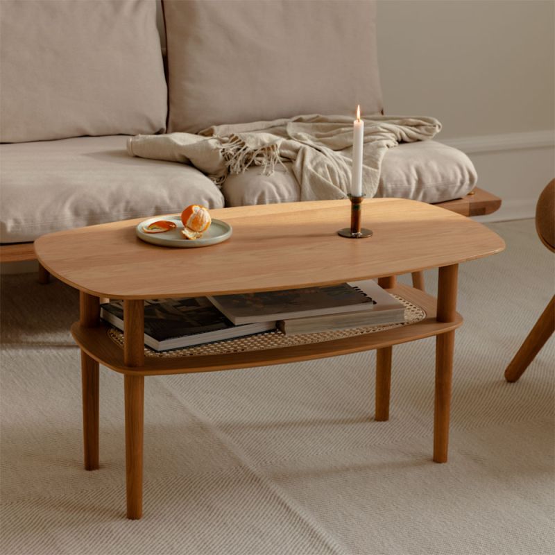 Elegant and concise coffee table with rattan shelf