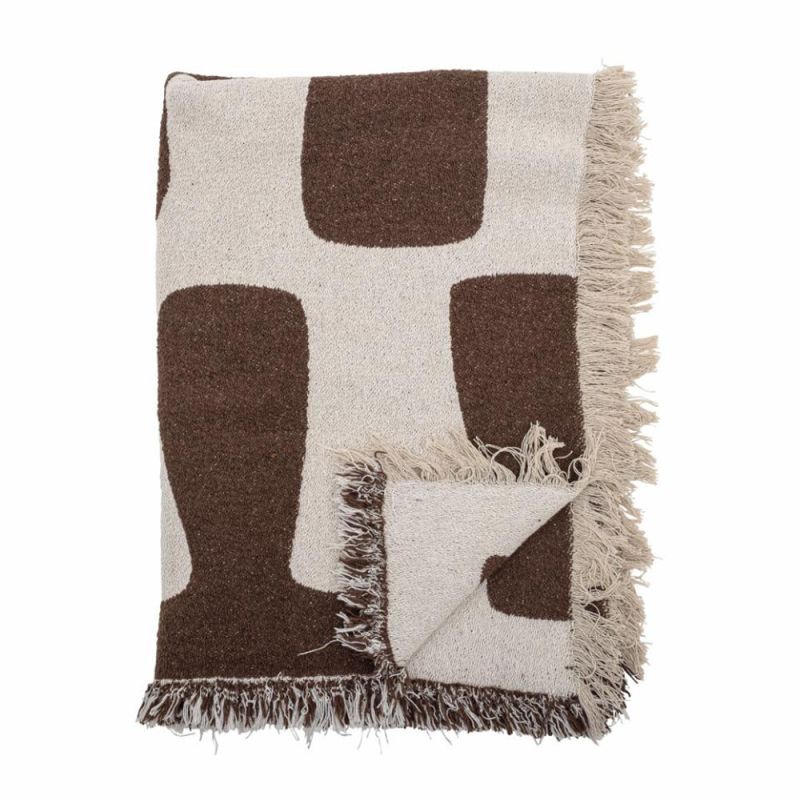 Natural throw with abstract brown design and tassels