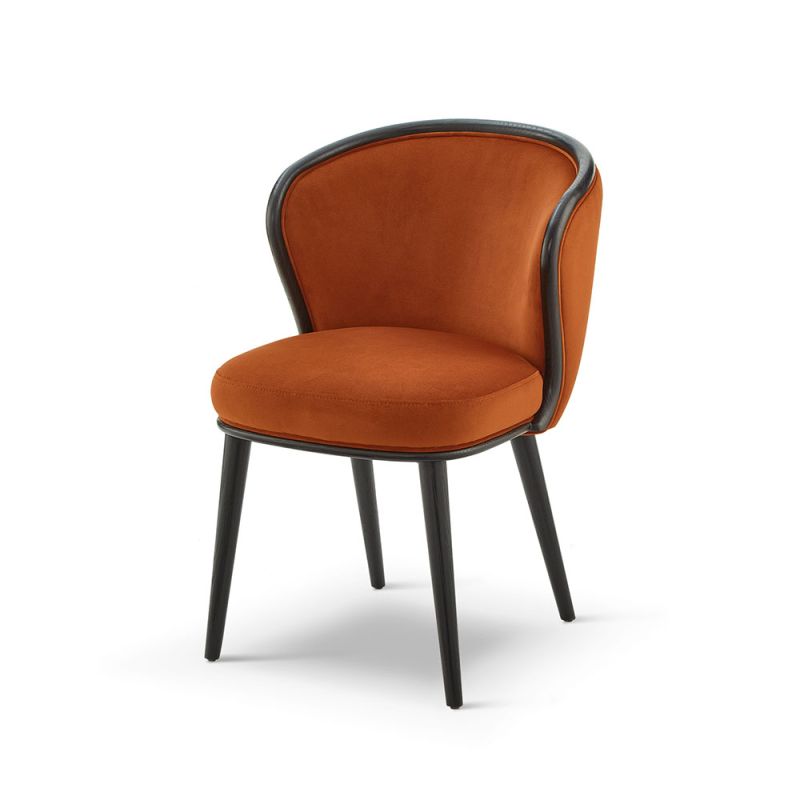 A statement recycled velvet upholstered dining chair with a curved backrest