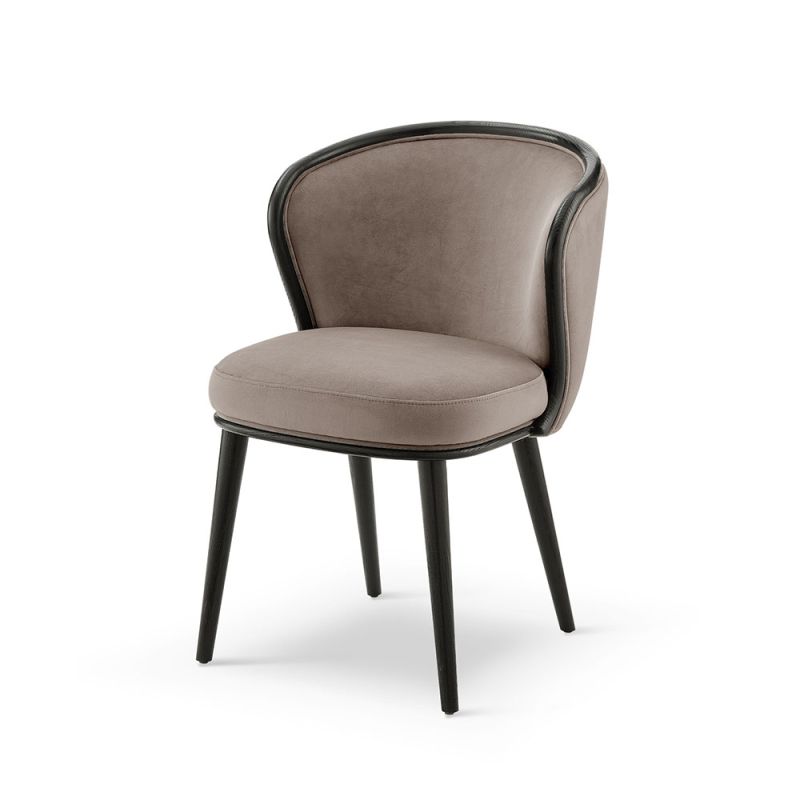 A luxury recycled velvet upholstered dining chair with a curved backrest