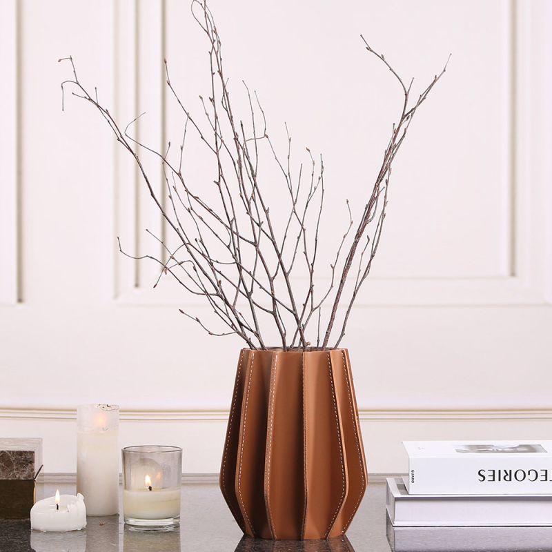 Stunning vase composed of brown leather and glass