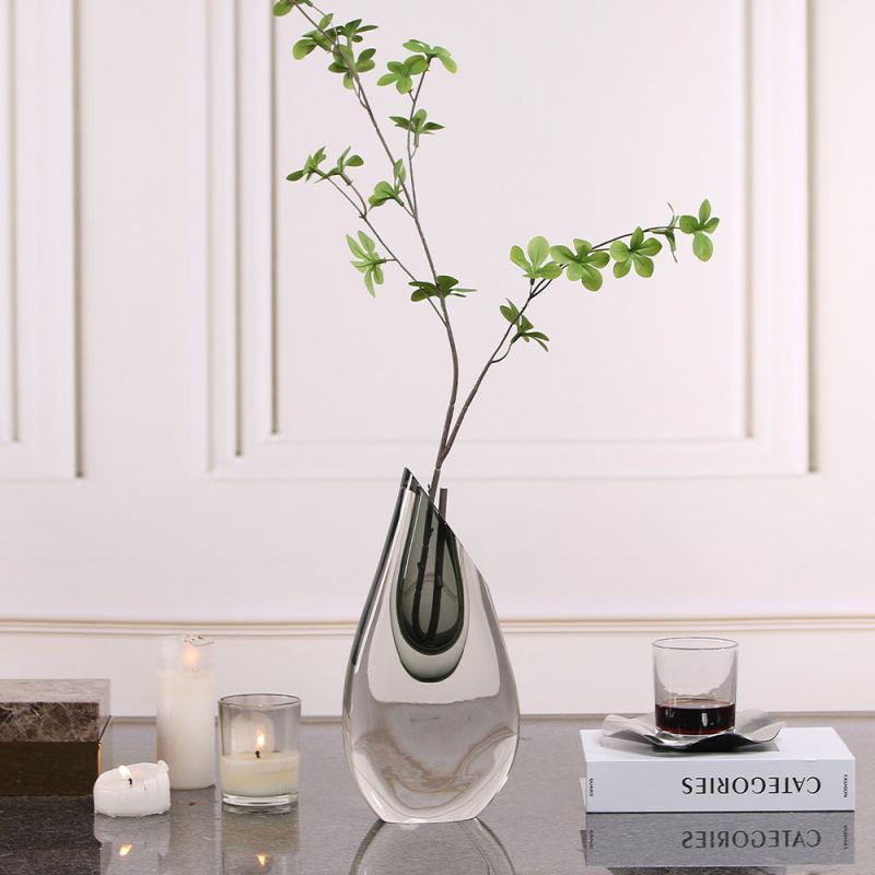 Elegant glass vase in smooth teardrop shape with a hint of grey
