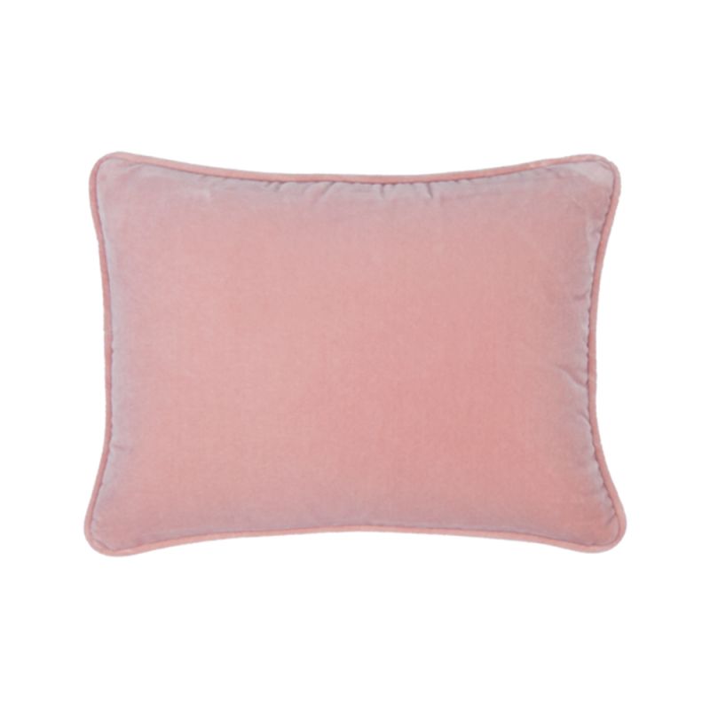 A velvet blush coloured rectangular cushion 