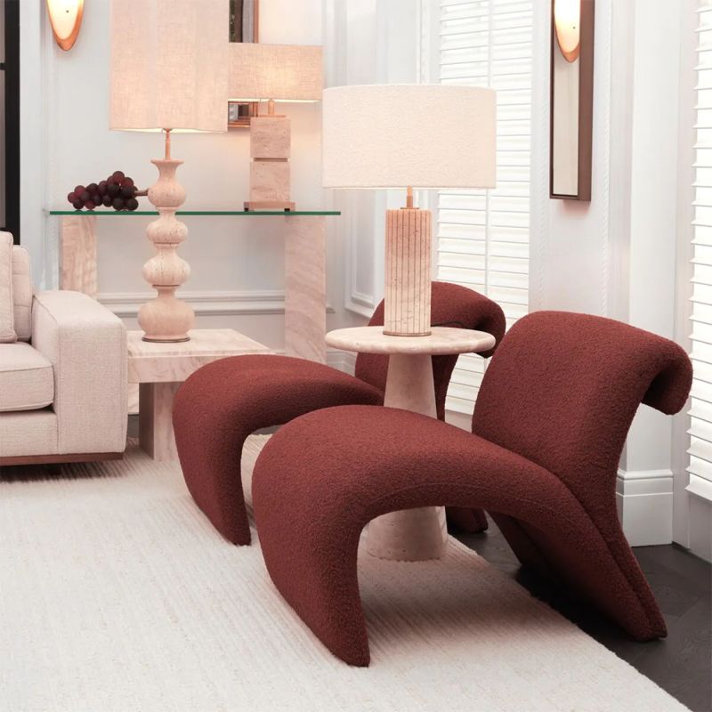 A contemporary chair by Eichholtz with a luxury boucle upholstery