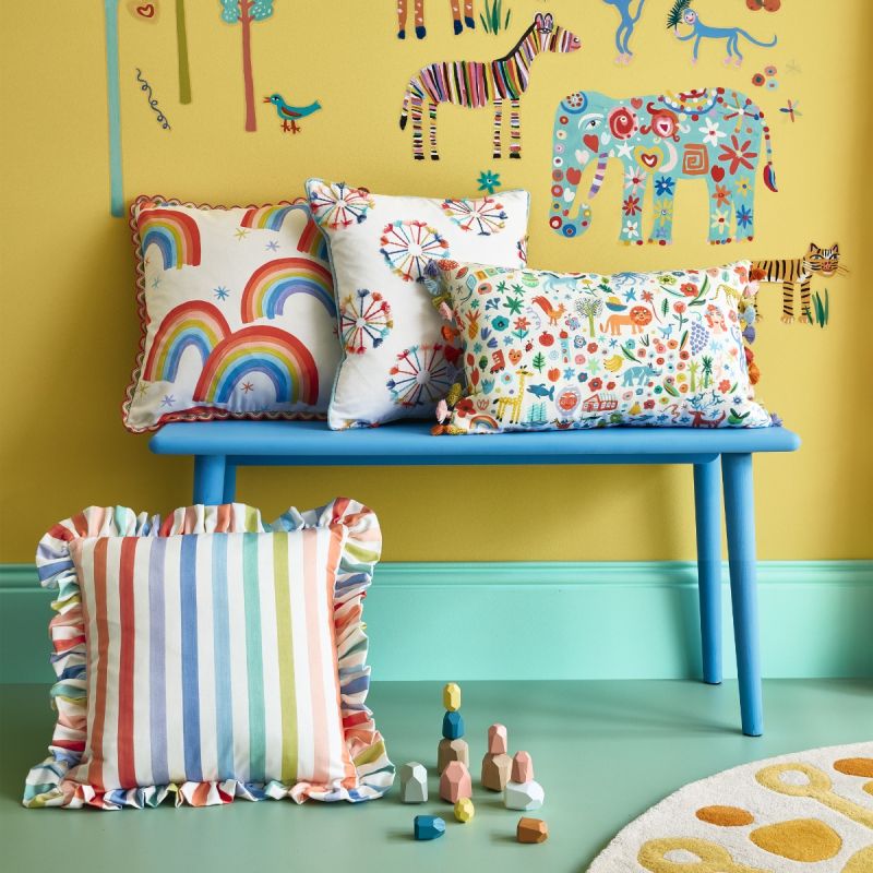 Striped multicoloured throw cushion with frilled edges.