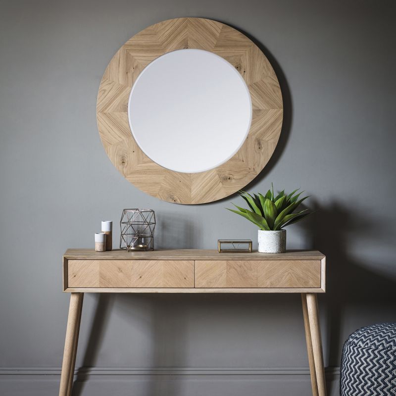 Warm wooden circular mirror with chevron design