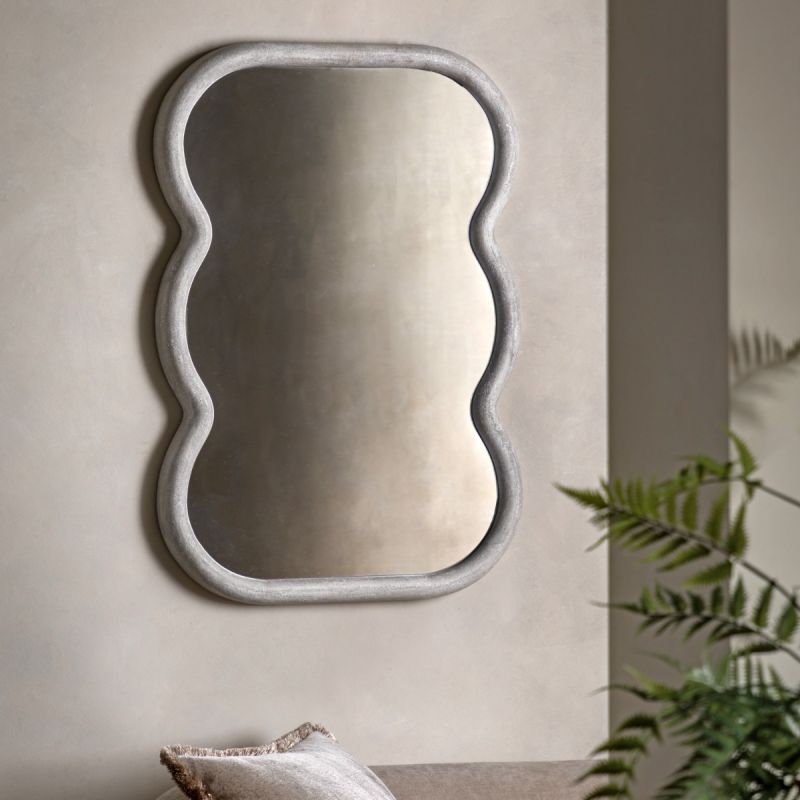 Wall mirror with a wavy edge detailing