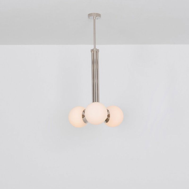 A glamorous polished nickel ceiling pendant inspired by early century and industrial style 