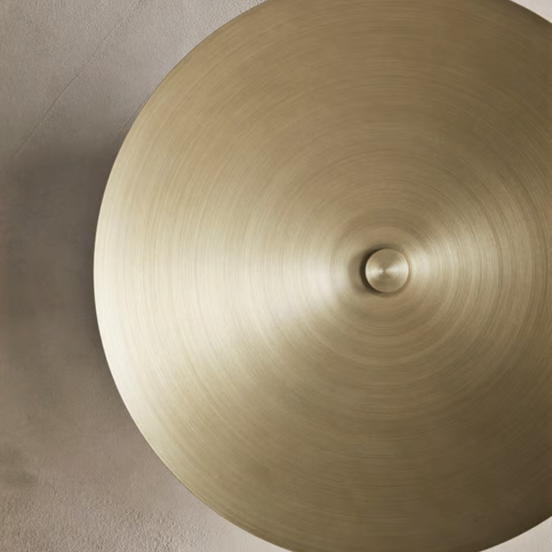 Illuminate your space beautifully with our Reflection Wall Sconce, crafted from brass-lacquered aluminum for a modern, stylish touch. Perfect for any decor!