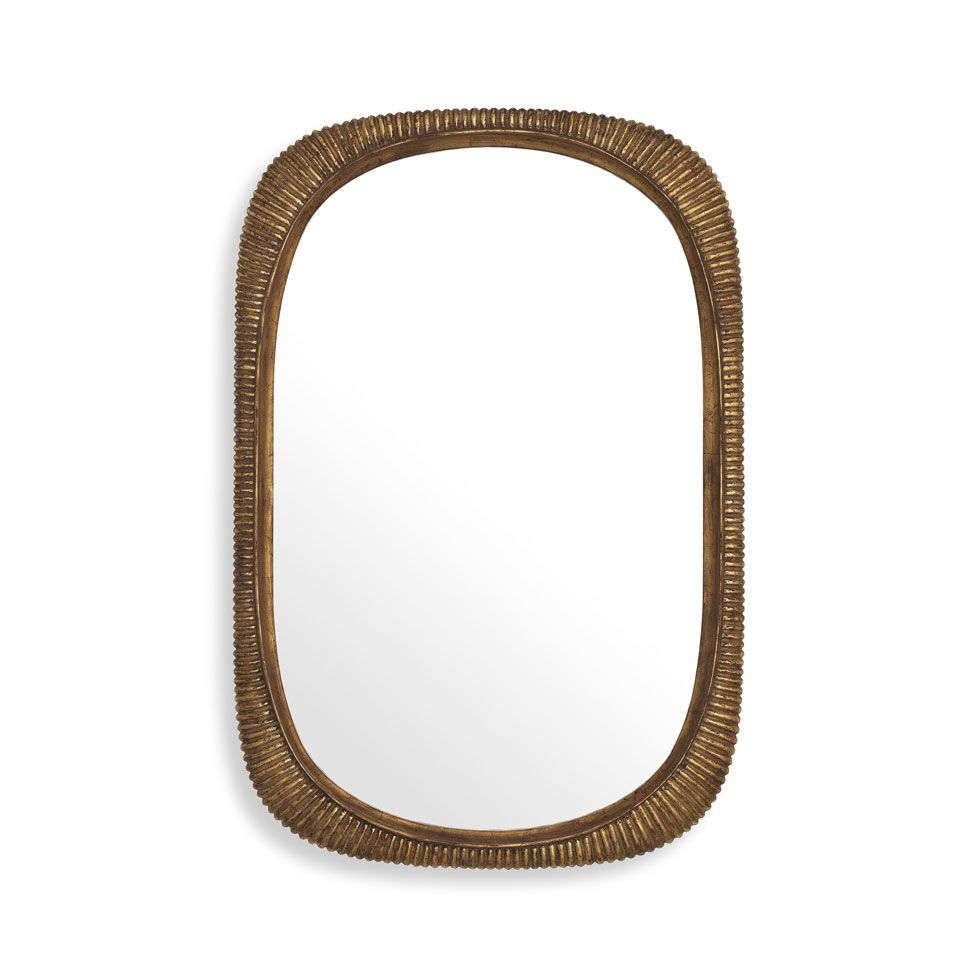 Glamorous wall mirror with antique brass ribbed frame