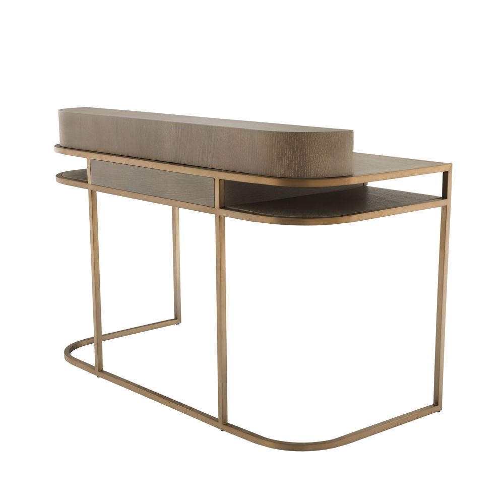 A contemporary desk by Eichholtz crafted from oak with a beautiful brass frame 
