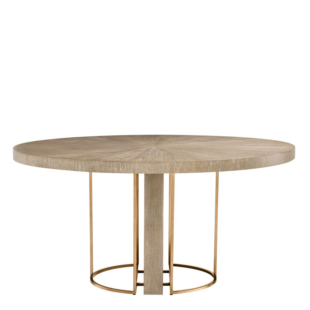 Light brown washed oak circular dining table with brass legs