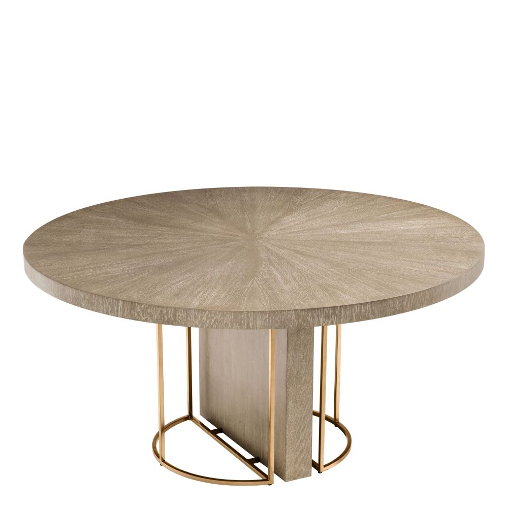 Light brown washed oak circular dining table with brass legs