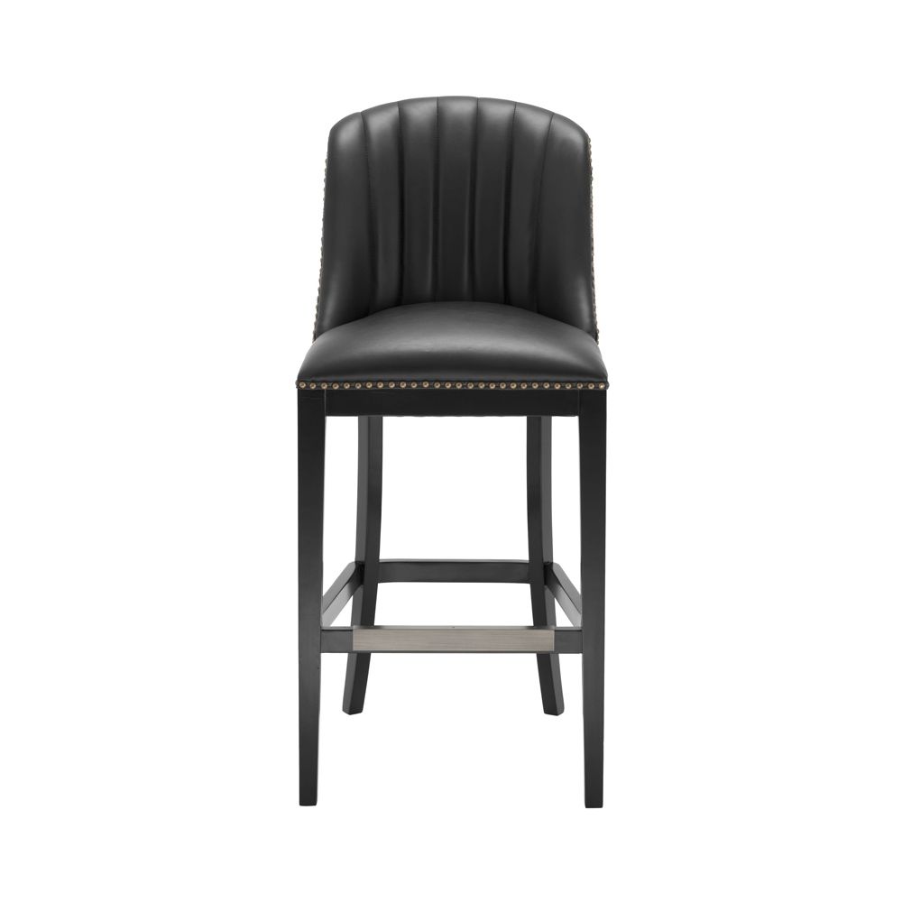 A chic black leather and velvet bar stool with antique brass studding