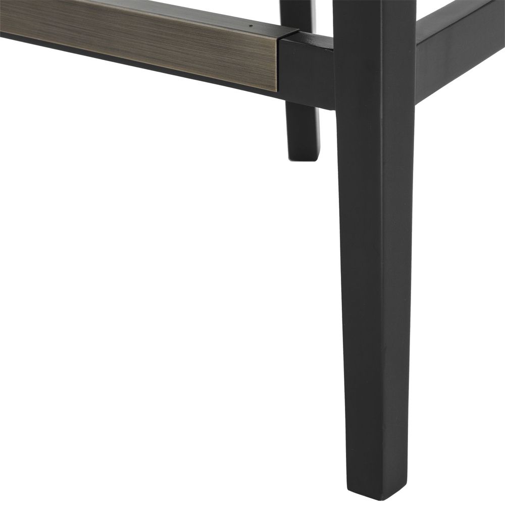 A chic black leather and velvet bar stool with antique brass studding