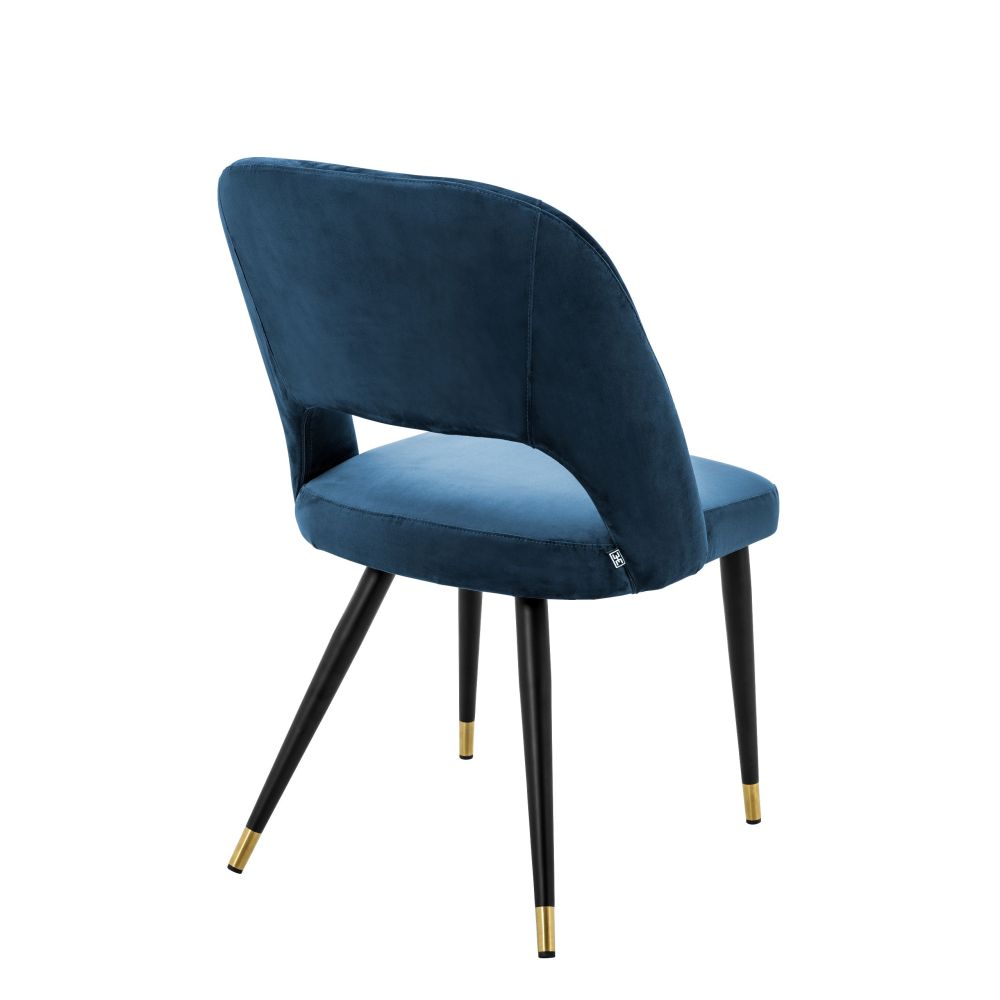 Contemporary blue velvet dining chair with brass capped tapered legs