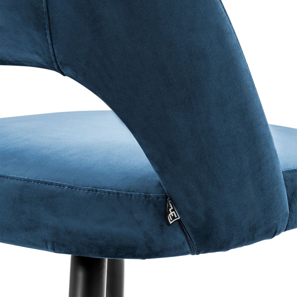Contemporary blue velvet dining chair with brass capped tapered legs