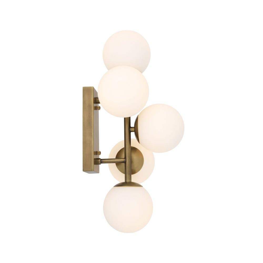 A stylish antique brass wall lamp with white glass shades