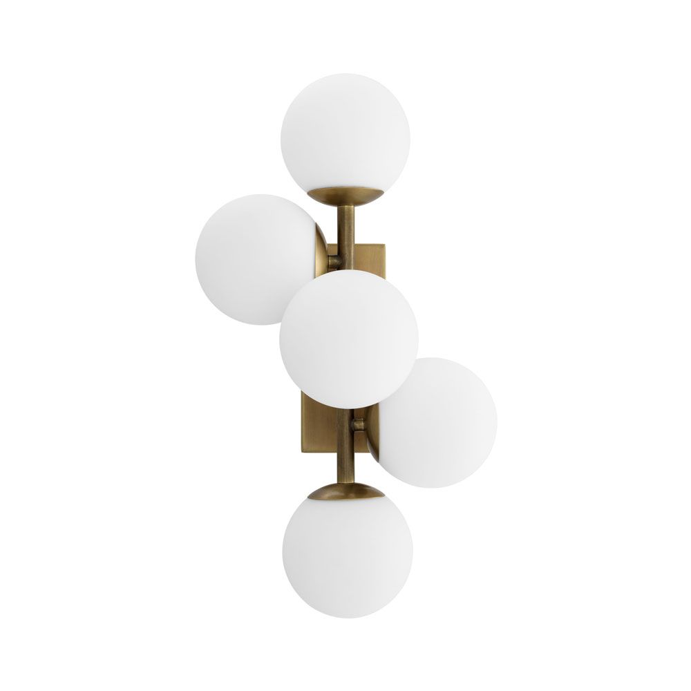 A stylish antique brass wall lamp with white glass shades