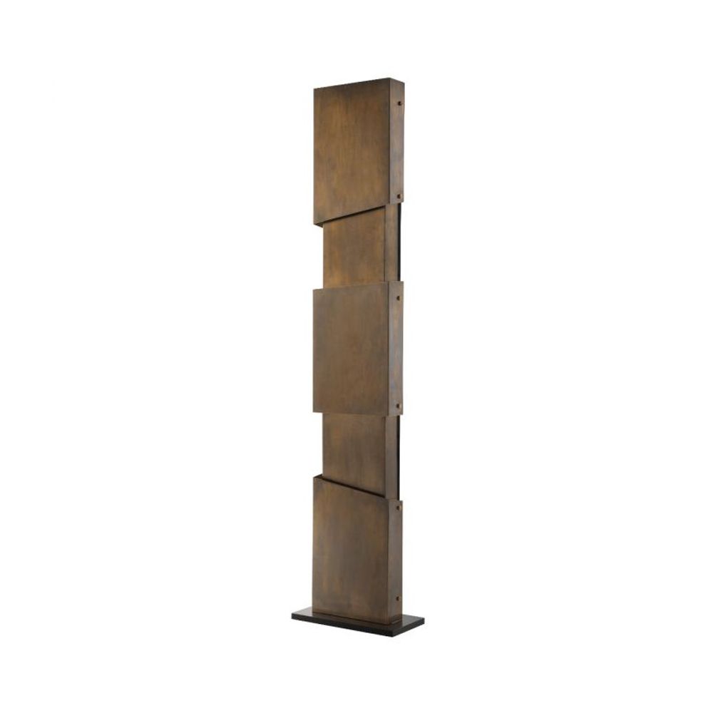 A chic industrial style floor standing lamp in a vintage brass finish