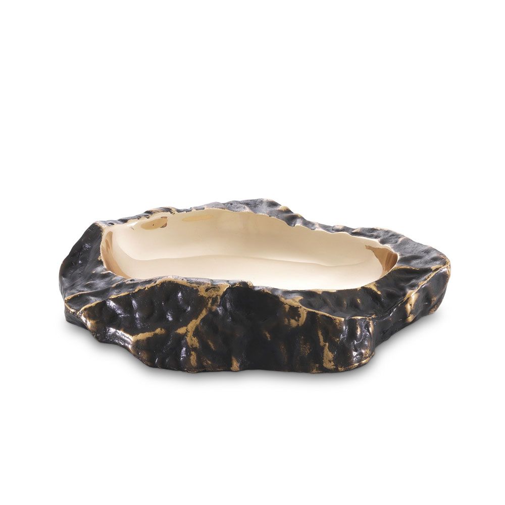 A luxurious rugged bronze bowl with a smooth, polished brass interior