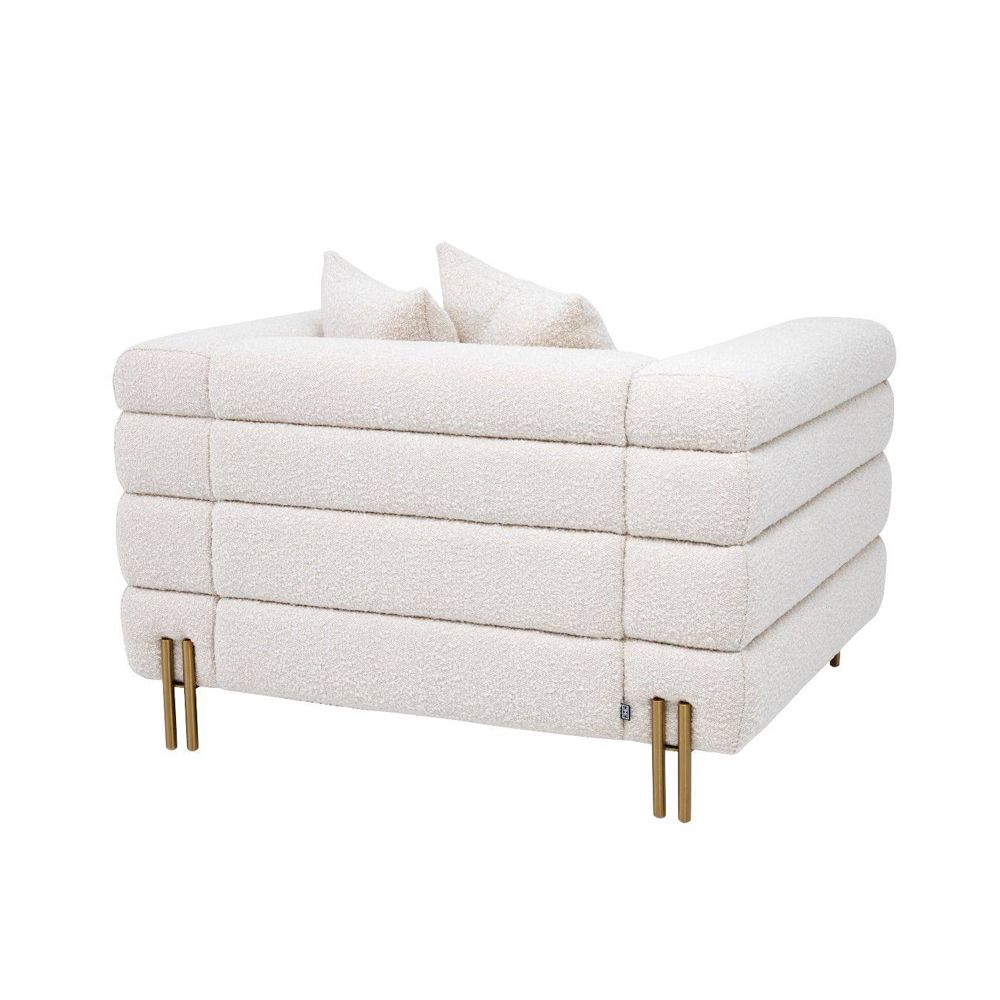 Luxurious modern armchair with brushed brass legs