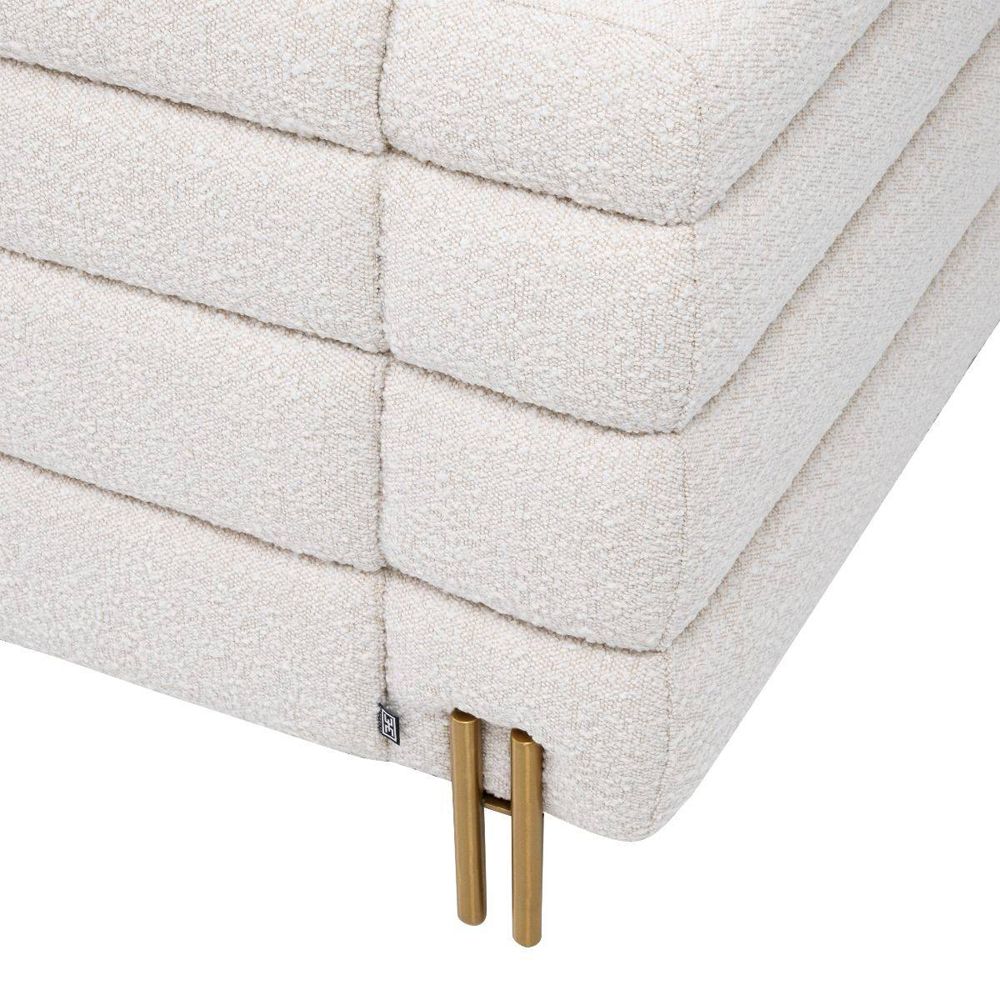 Luxurious modern armchair with brushed brass legs