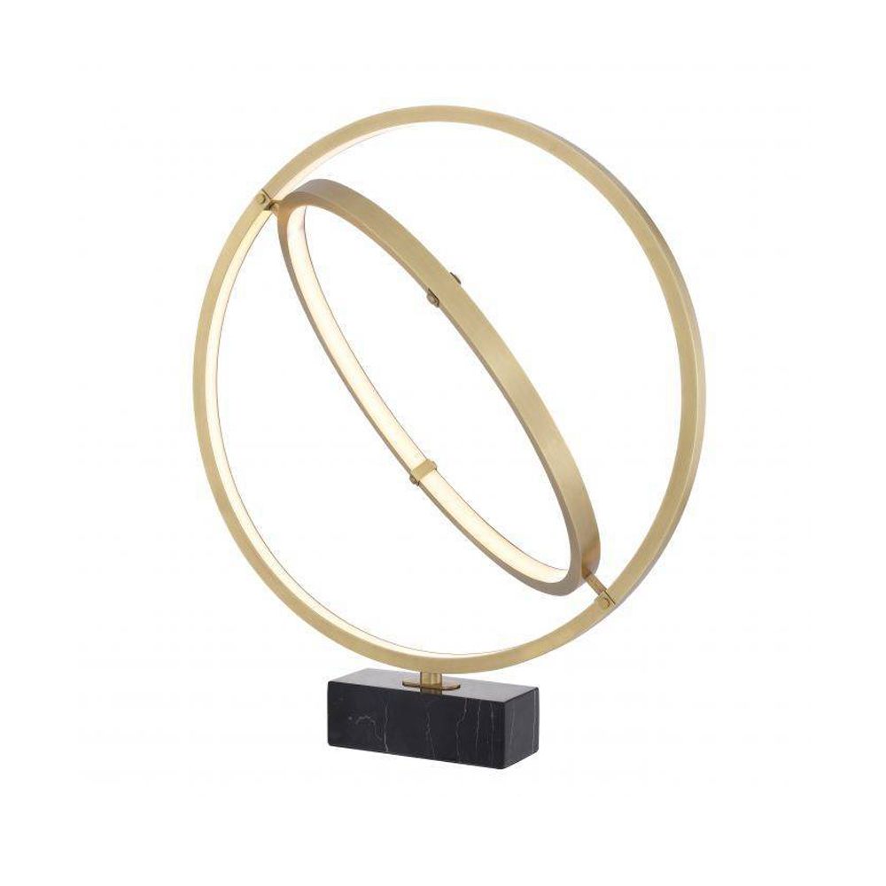 A galaxy halo-inspired table lamp in antique brass finish