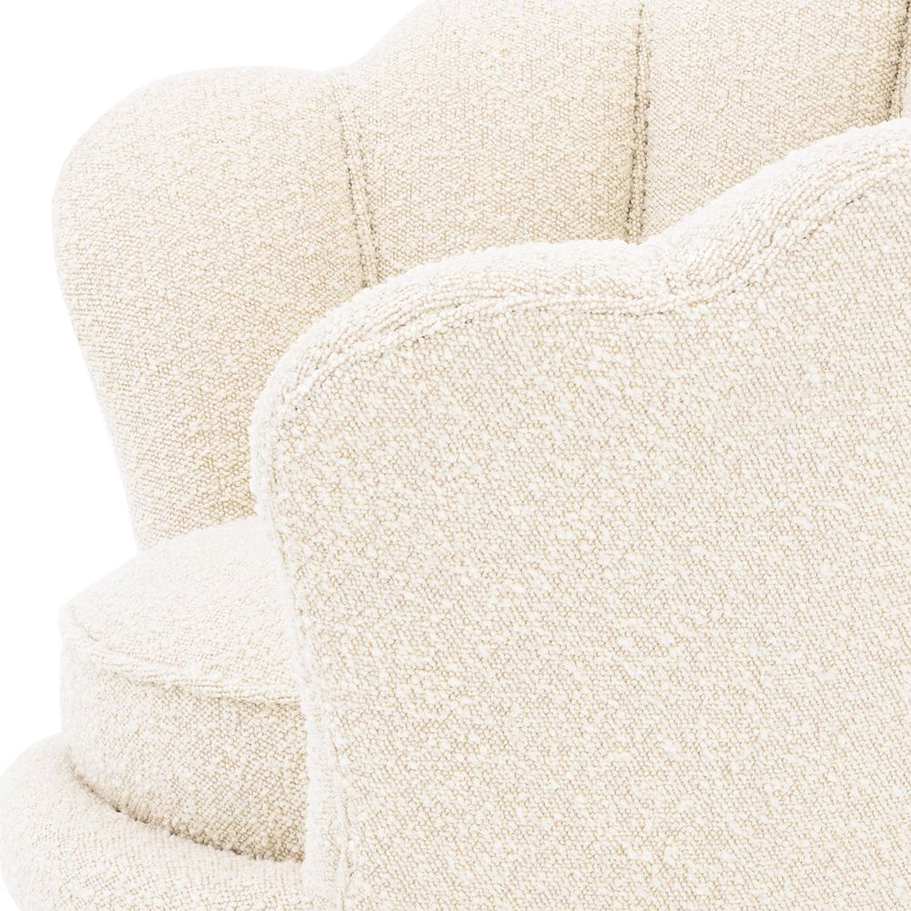 art deco-inspired boucle trapezium armchair with brass legs