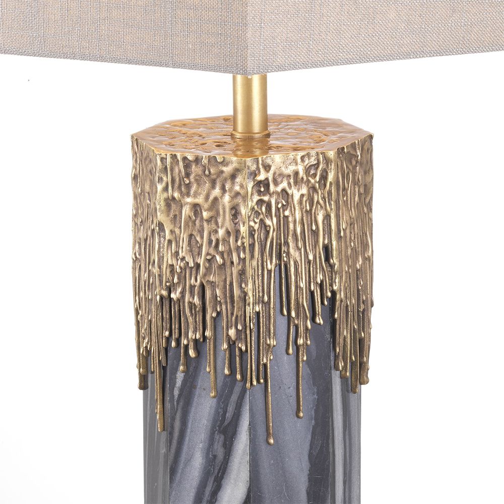 Luxurious Eichholtz grey marble table lamp with vintage brass accents and a linen shade