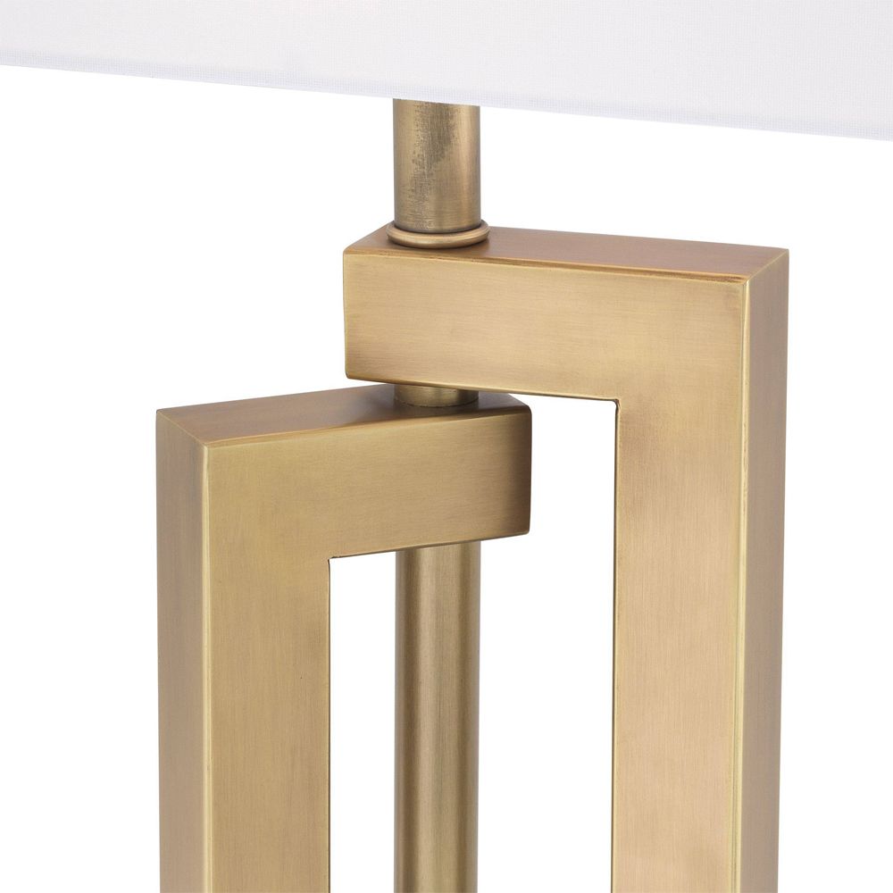 Eichholtz geometric style table lamp in an antique brass finish with a white rectangular shade on granite base