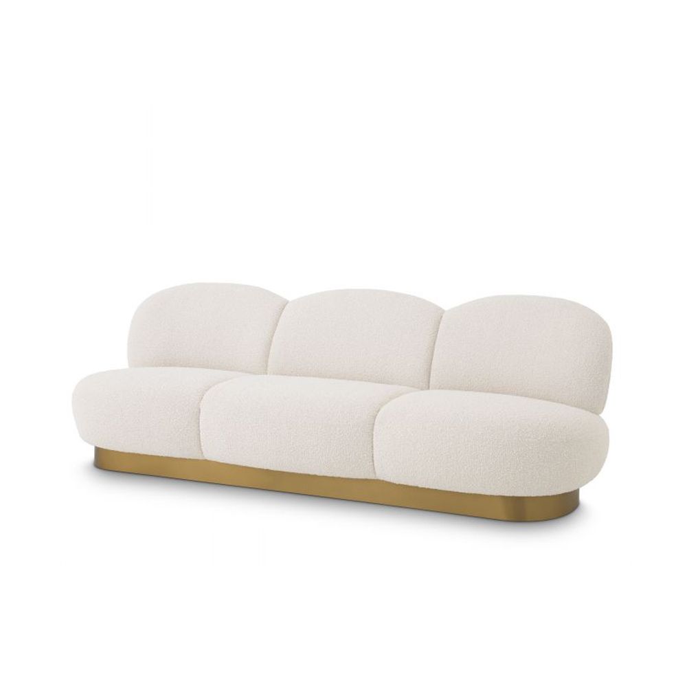 A fabulous three-seater boucle cream-upholstered sofa