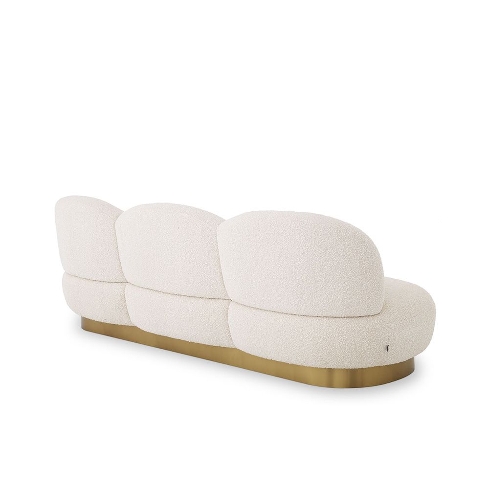 A fabulous three-seater boucle cream-upholstered sofa