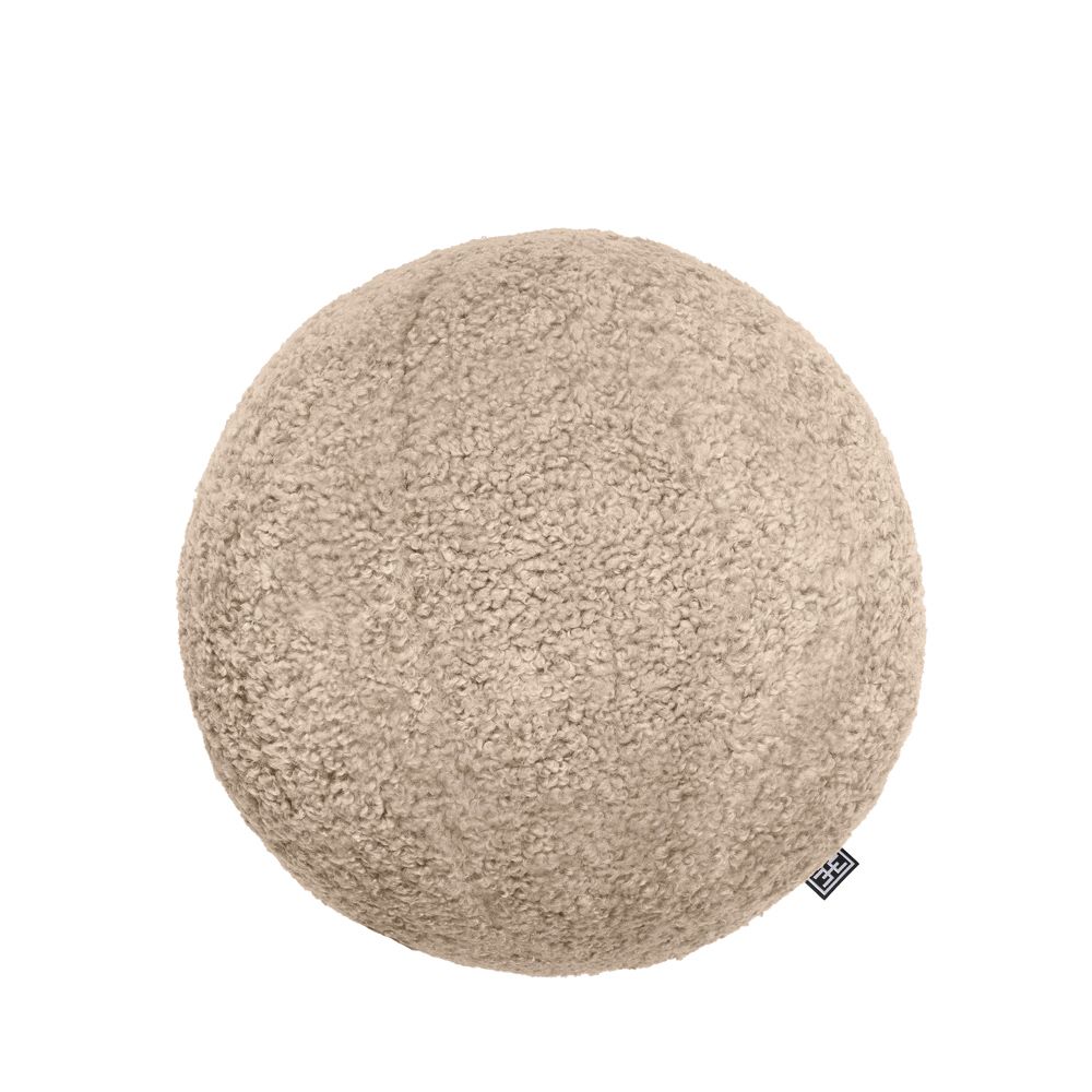A luxurious spherical cushion in canberra sand upholstery 
