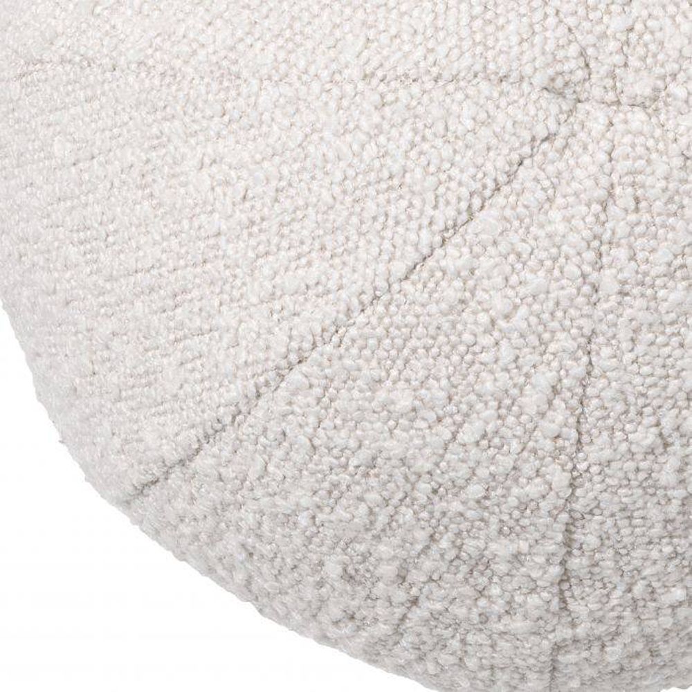 A luxurious small round boucle cushion 