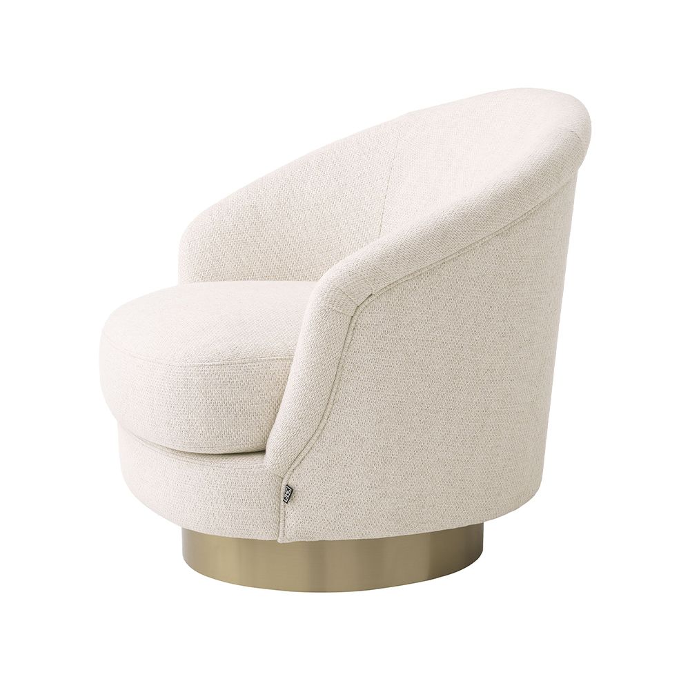 A luxury swivel chair by Eichholtz with a Pausa Natural upholstery and brushed brass base