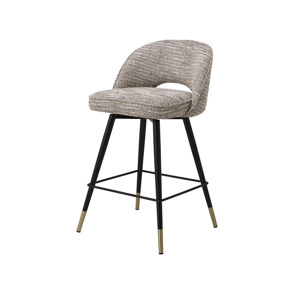 A luxury set of counter stools by Eichholtz with a Mademoiselle Beige upholstery and brass capped feet
