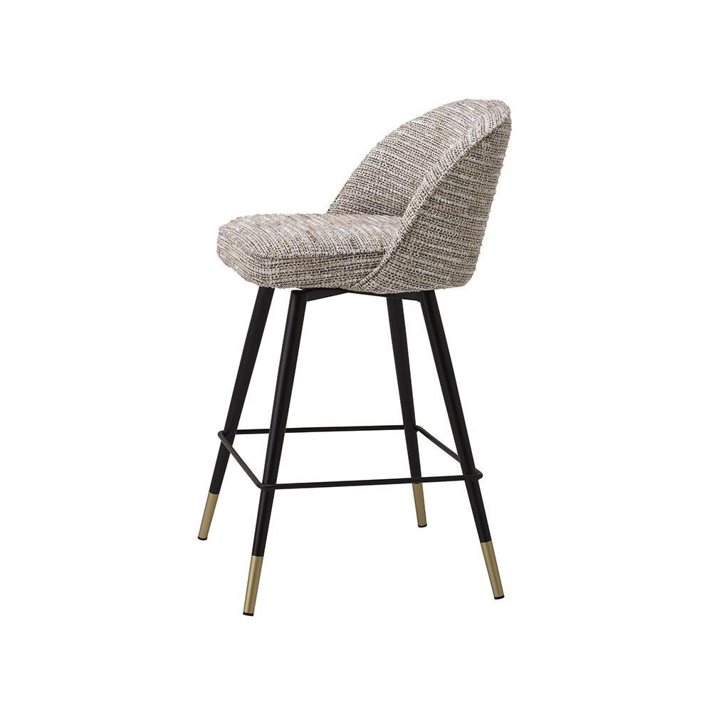 A luxury set of counter stools by Eichholtz with a Mademoiselle Beige upholstery and brass capped feet