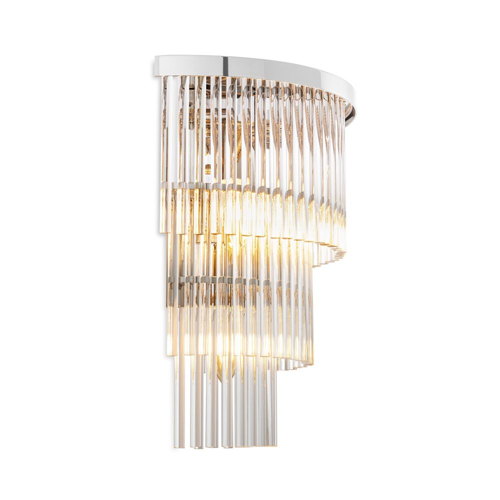 An elegant clear glass and polished nickel wall lamp