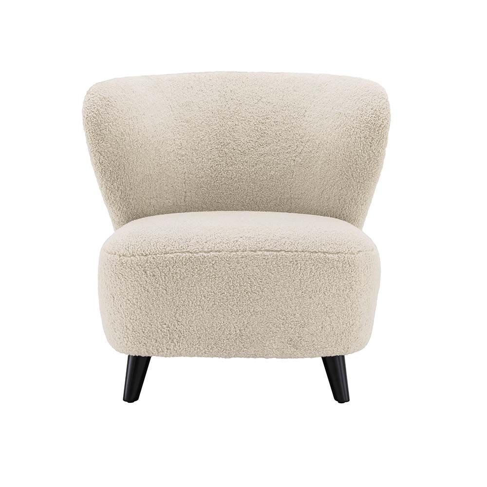 A luxury chair by Eichholtz with a dreamy upholstery and contrasting black feet