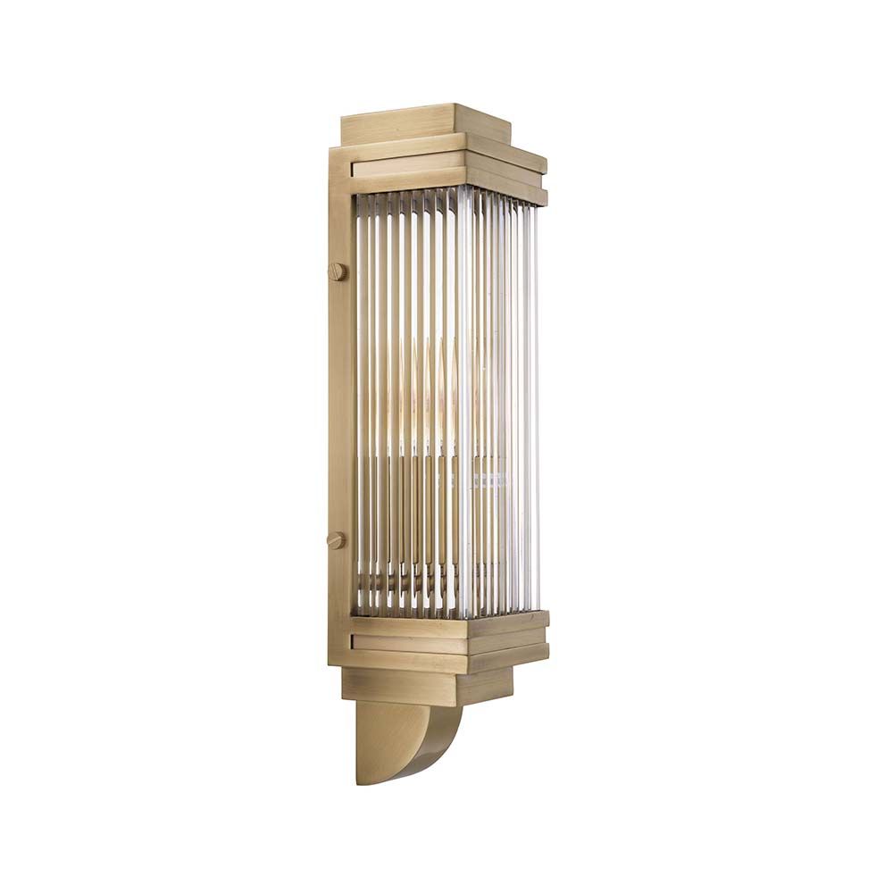 A vintage and art deco inspired wall lamp in a brass finish adorned with glass rods.
