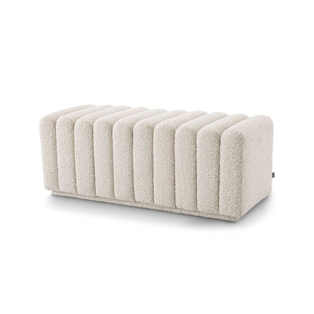 A stylish boucle cream bench with deep channel stitching by Eichholtz
