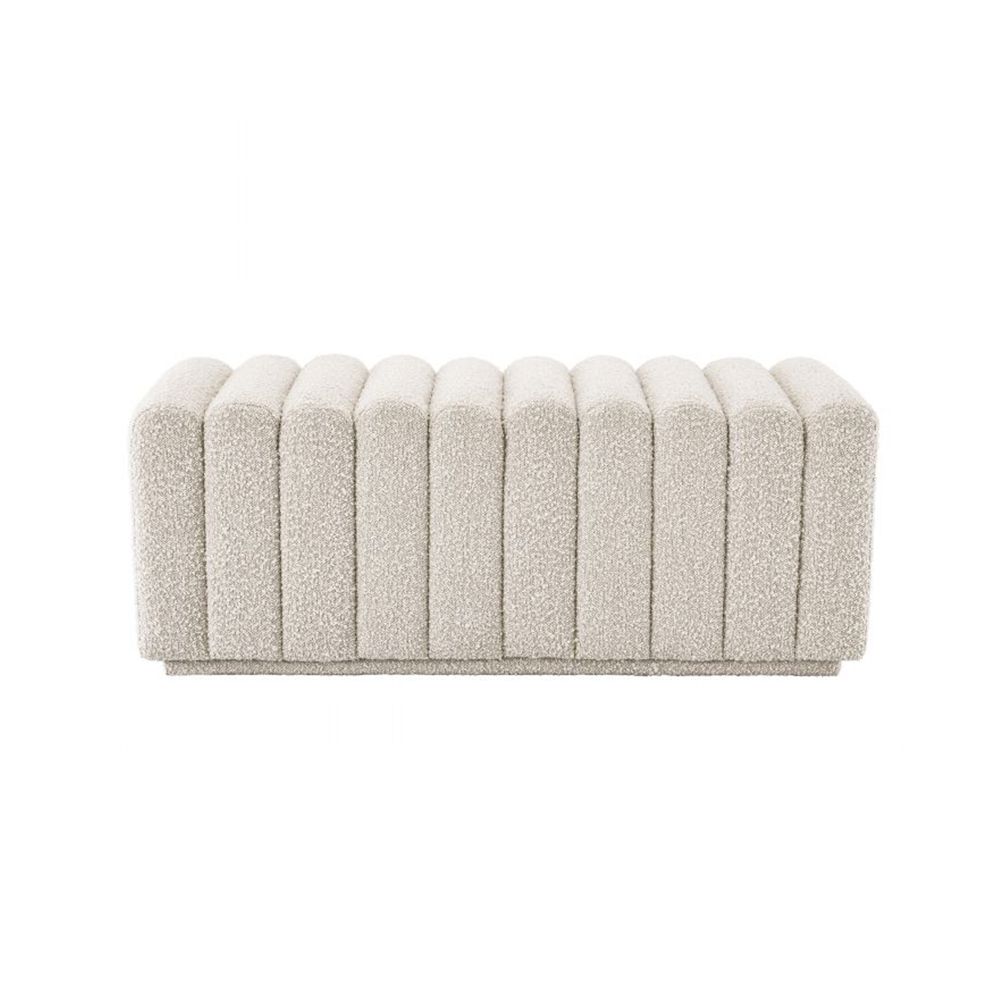 A stylish boucle cream bench with deep channel stitching by Eichholtz