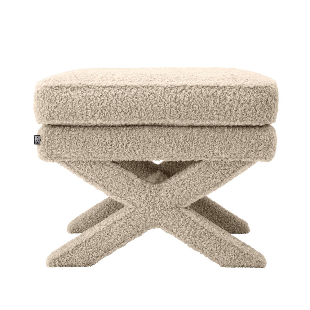 A stunning fluffy brown ottoman with x-shaped legs 