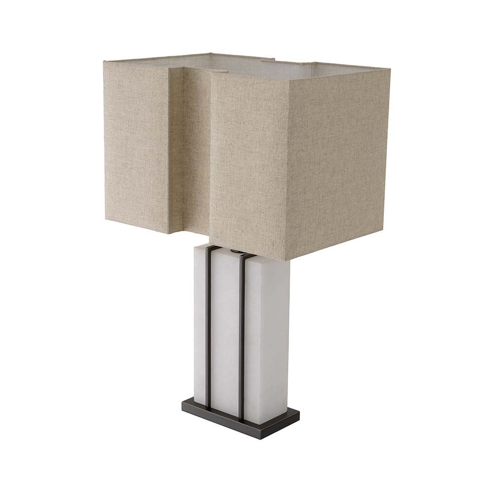 A contemporary table lamp with an alabaster base encased with a brass frame.
