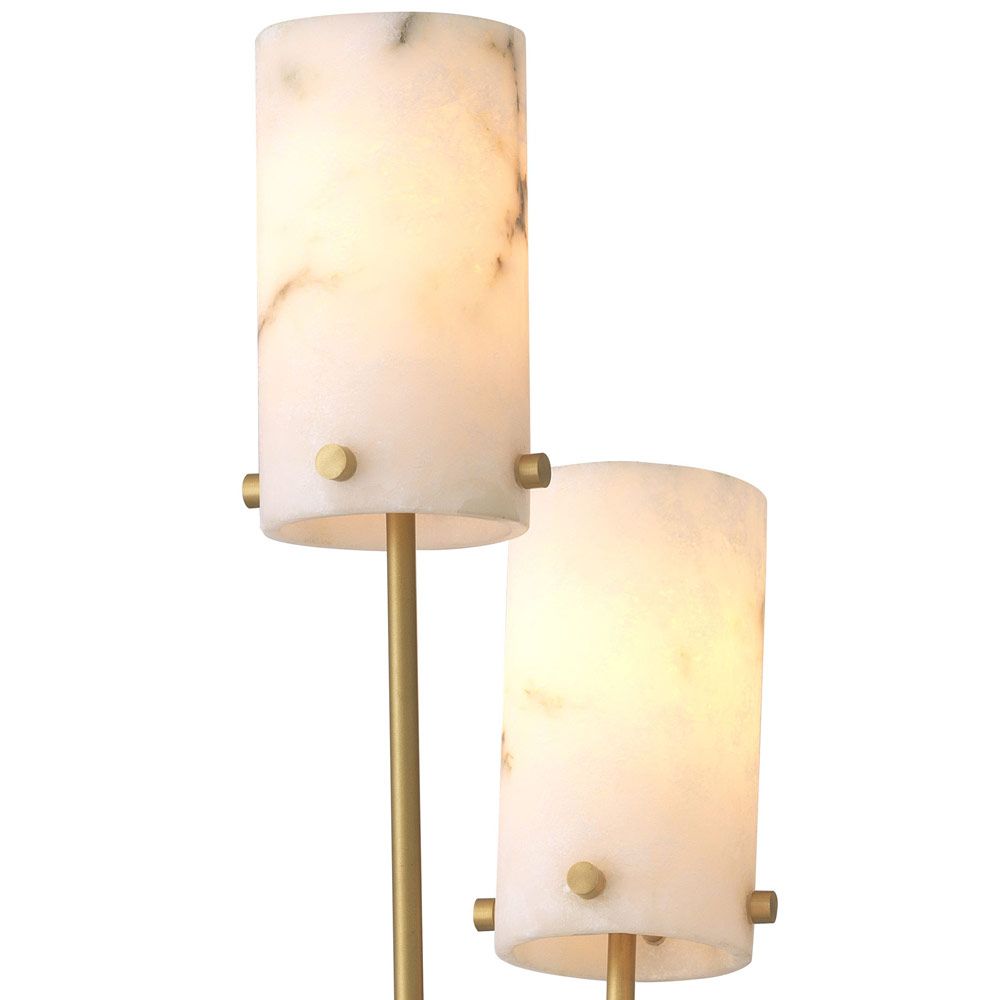 A stylish floor lamp by Eichholtz with three alabaster lamp holders fitted on antique brass stems with a honed black marble base