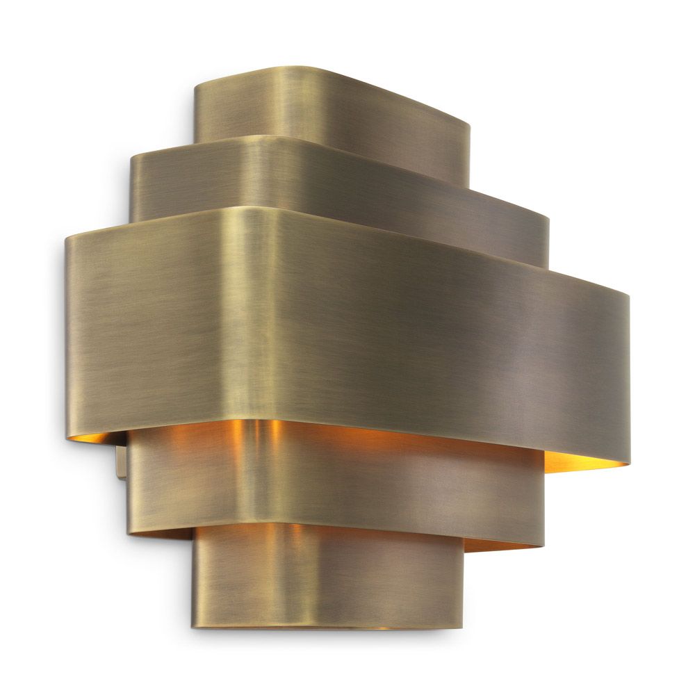 A statement, Art-Deco wall lamp with a vintage brass finish 